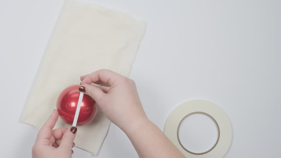 DIY Deadpool Holiday Ornament Craft - Use white grease pencil to sketch basic half-circle eye shape