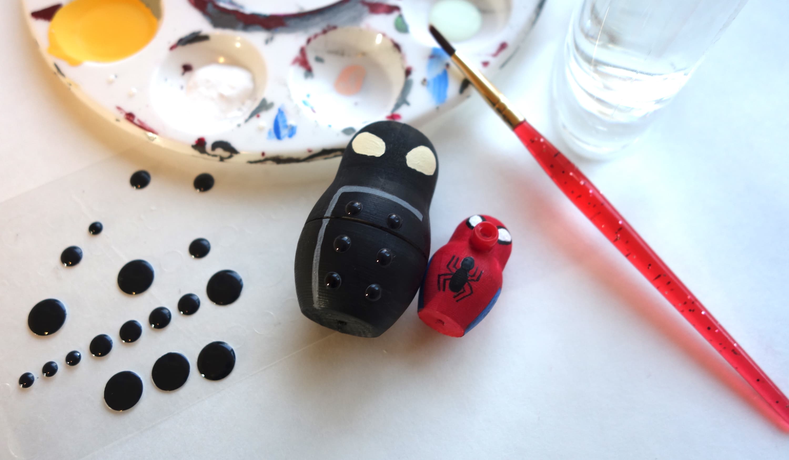 Spider-Geddon Nesting Dolls: stick six small enamel black dots